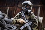 Best military gas mask A military on the field wearing a gas mask.